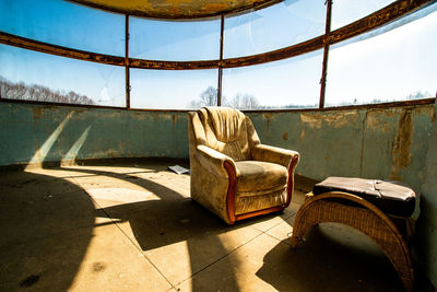 Empty chair in abandoned room
