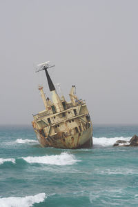 View of ship in sea against clear sky