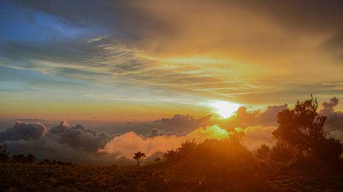 Scenic view of dramatic sky during sunset