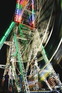 Low angle view of illuminated ferris wheel