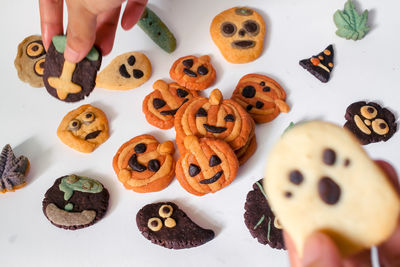 High angle view of hand holding cookies
