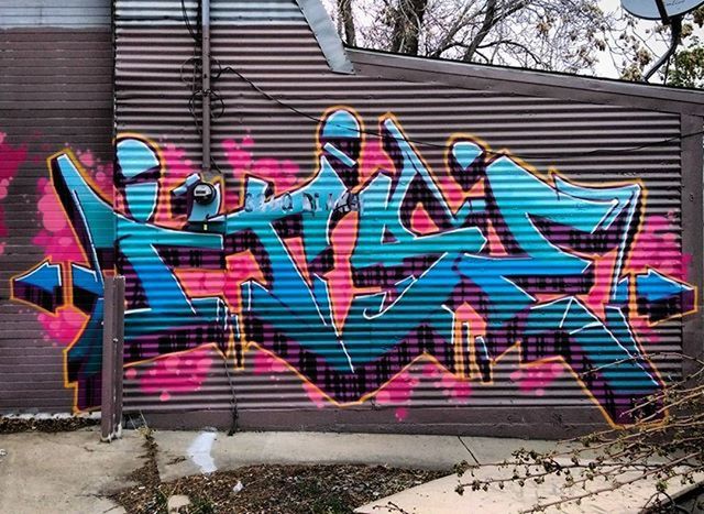 red, built structure, absence, empty, architecture, building exterior, sunlight, day, graffiti, no people, wall - building feature, chair, outdoors, tree, striped, flag, seat, bench, multi colored, wall