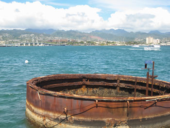 Ship moored on sea against sky