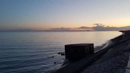 Scenic view of sea against clear sky during sunset