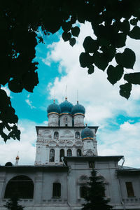 Low angle view of building against cloudy sky