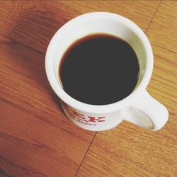 Close-up of coffee cup on table