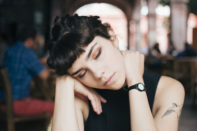 Close-up of woman with eyes closed