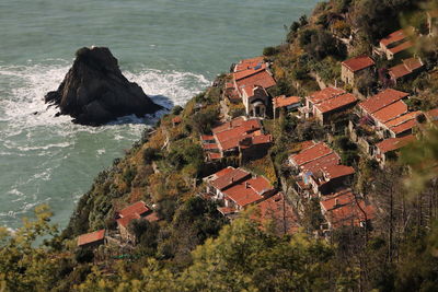 High angle view of townscape by sea