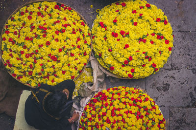 High angle view of yellow flowers for sale at market stall