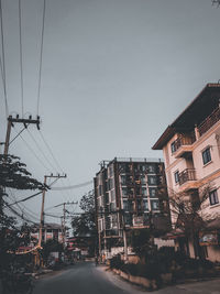 Street amidst buildings against sky in city