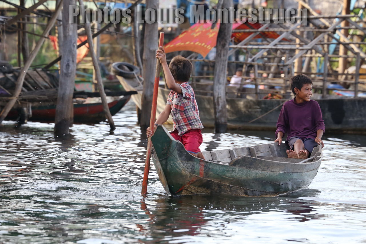 gondola - traditional boat, water, nautical vessel, transportation, canal, males, cultures, tourist, tourism, men, travel destinations, women, females, outdoors, people, happiness, adult, gondolier, smiling, togetherness, oar, young adult, adults only, occupation, rowing, day