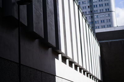 Low angle view of modern building in shadow and light