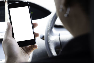 Close-up of man using mobile phone