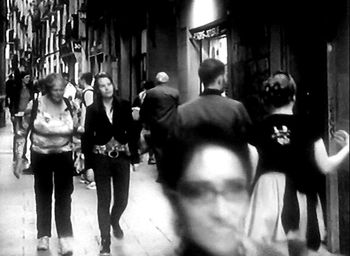 Woman standing in city at night