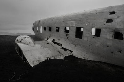 View of the wreckage of an american dc-3 military plane crashed on a beach in iceland