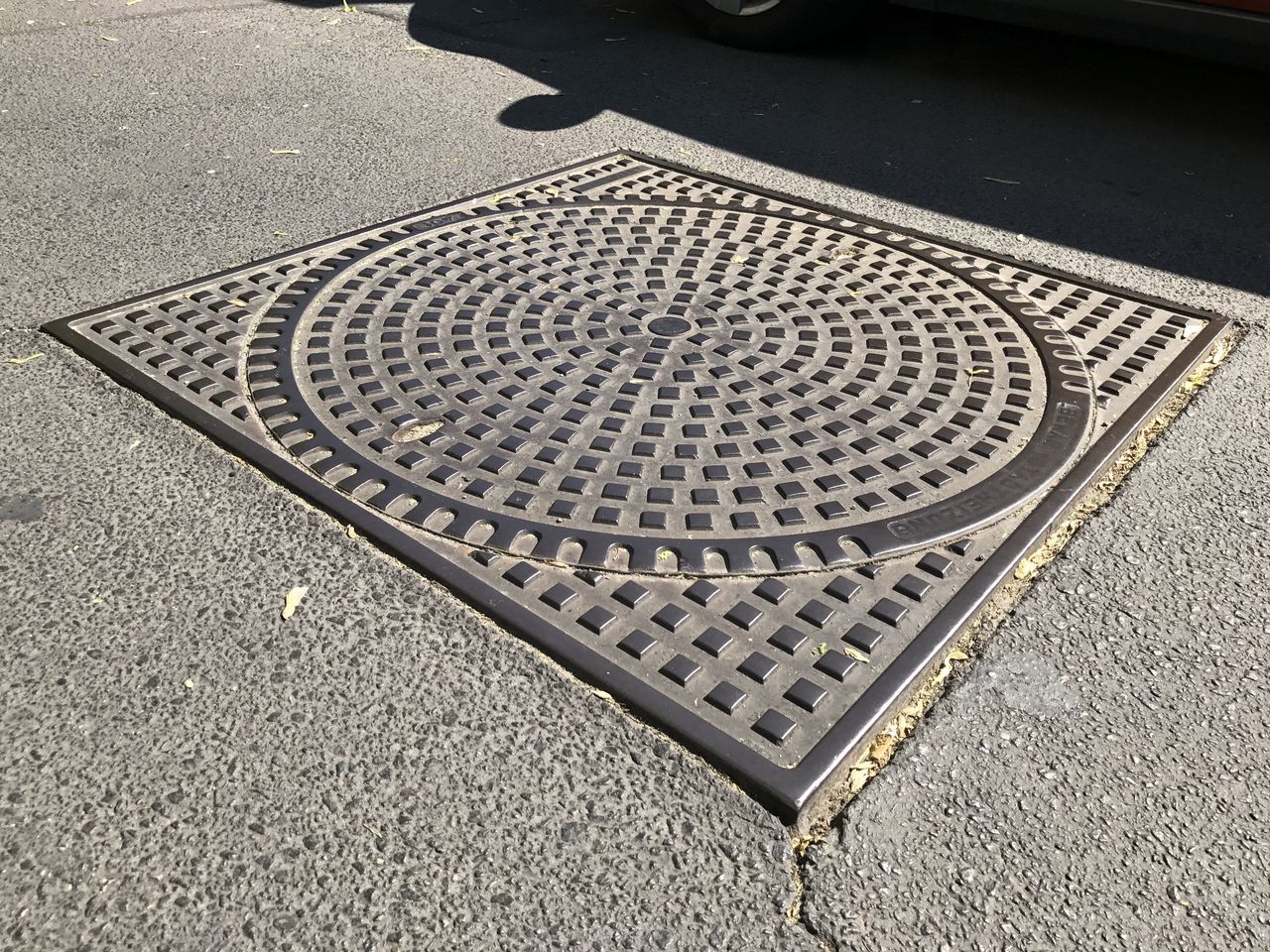 CLOSE-UP OF MANHOLE