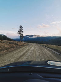 Country road seen through car windshield