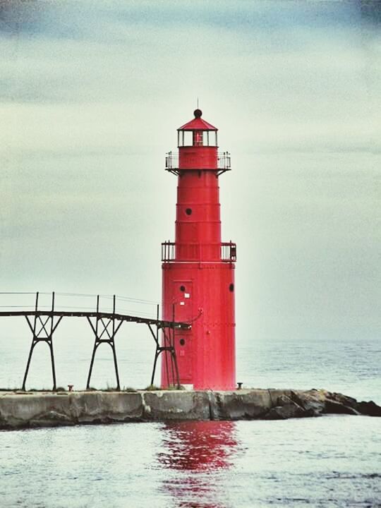 lighthouse, sea, water, guidance, safety, protection, security, direction, sky, built structure, architecture, horizon over water, red, waterfront, building exterior, rippled, tranquility, tranquil scene, day, nature