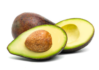 Close-up of green fruits against white background