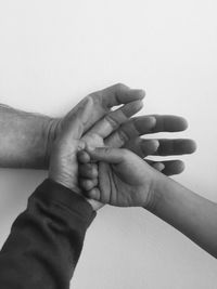 Close-up of couple holding hands