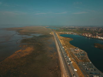 High angle view of river and city against sky