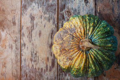 High angle view of pumpkin on wooden table