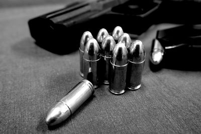 Close-up of bullets and handgun