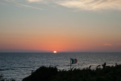 Scenic view of sea at sunset