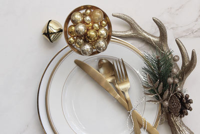 Close-up of christmas ornaments and plates on table