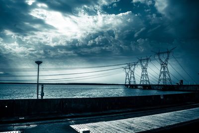 Bridge over sea against sky