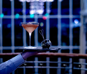 Cropped hand holding drink