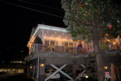 Low angle view of illuminated street light at night