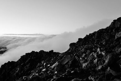 Haleakala crater against sky during foggy weather