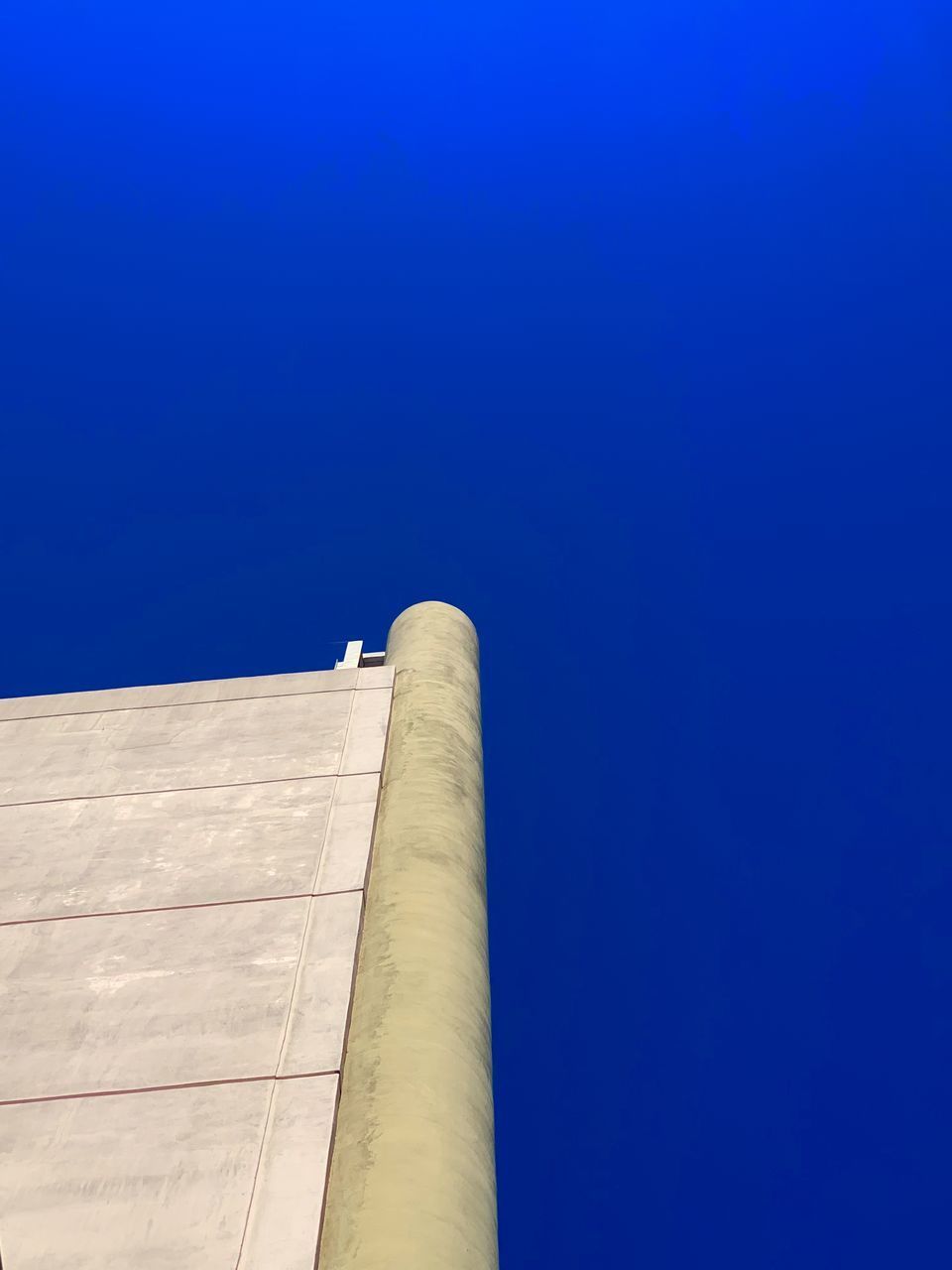 LOW ANGLE VIEW OF SMOKE STACKS AGAINST SKY