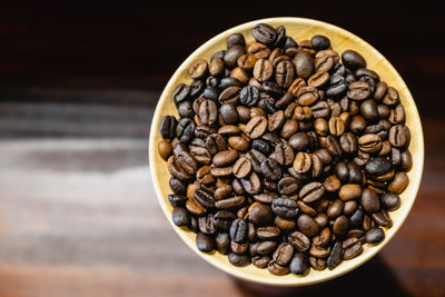 Close-up of coffee beans on table