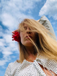 Low angle view of woman against sky