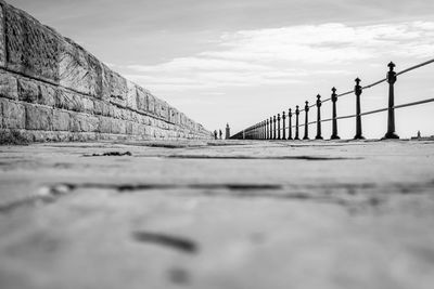 Surface level of pier against sky