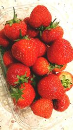 High angle view of strawberries on table