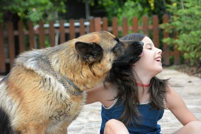 Full length of woman with dog