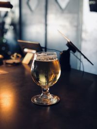 Close-up of beer glass on table