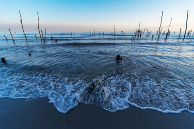 Scenic view of sea against sky during winter