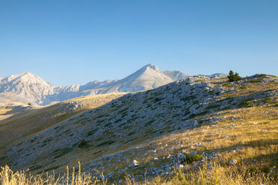 Scenic view of mountains against clear sky