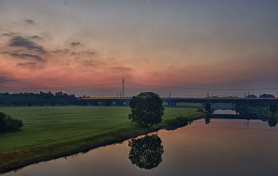 Scenic view of bridge against sky during sunset