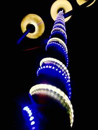 Low angle view of illuminated lights at night