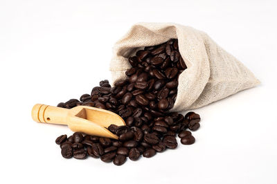 Close-up of coffee beans against white background