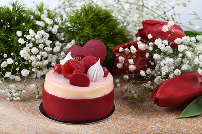 Close-up of red roses on table