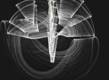 Close-up of light painting against black background