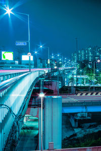 Illuminated city against sky at night