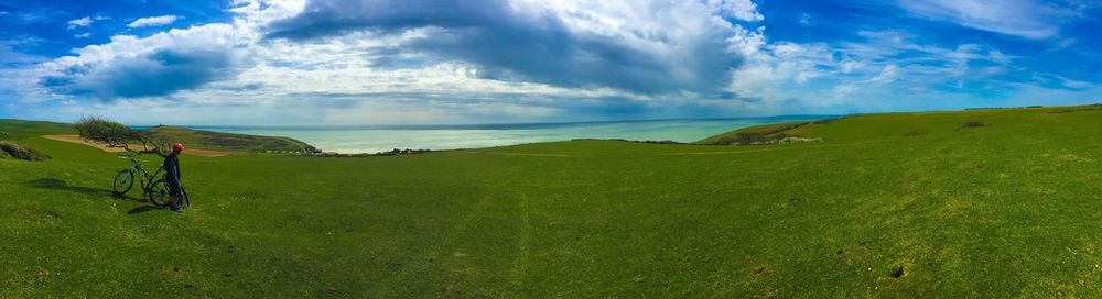 Scenic view of sea against cloudy sky