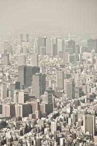 High angle view of buildings in city against sky